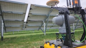 Husky Observer with its PTZ camera pointed towards the underside of a solar panel.